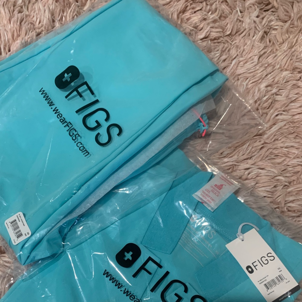 Sold out FIGS in neon blue. Inala and muli in XS.